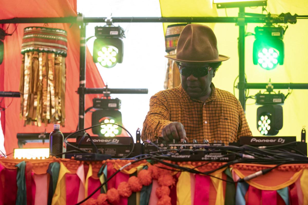 Pictures from Camp Bestival 2021 at Lulworth Castle.  Photos of Norman Jay playing the Bollywood stage by rockstarimages.co.uk. 