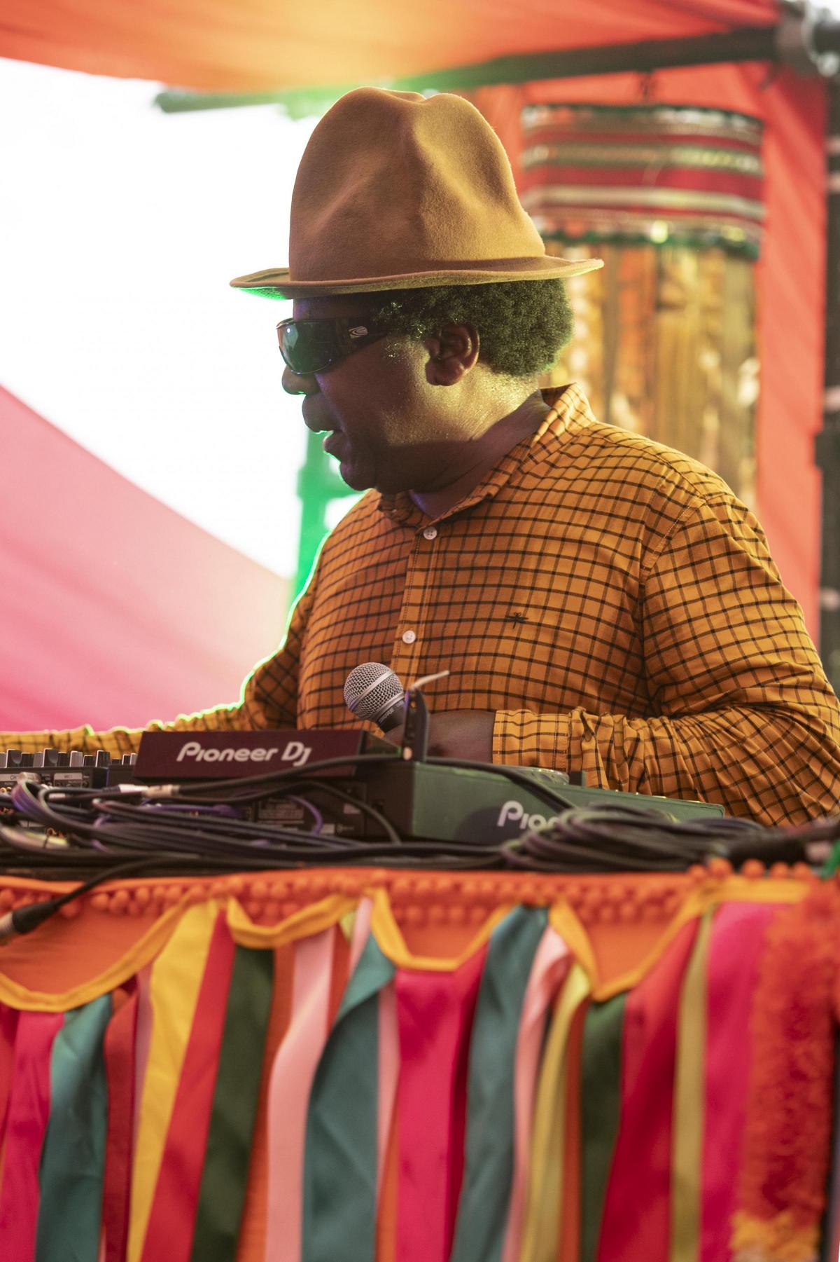 Pictures from Camp Bestival 2021 at Lulworth Castle.  Photos of Norman Jay playing the Bollywood stage by rockstarimages.co.uk. 