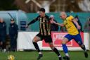 Toby Holmes and Keith Emmerson do battle at BlackGold Stadiium (Picture: Ian Middlebrook)