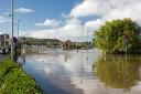 Weymouth Swannery car park flooding over the harbour walls