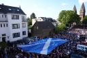 The Tartan Army walk past St. Vitalis church in Cologne during an organised walk to the stadium before the UEFA Euro 2024 Group A match at the Cologne Stadium