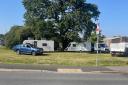 The travellers have set up on a green space near Sainsbury's