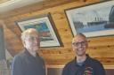 Dale Wilkins presenting Roger Clisshold, New Quay RNLI treasurer with the cheque