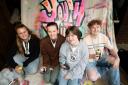 Young people decorating Heathfield youth hub with graffiti