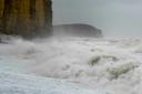 Large waves crash ashore on the beach during Storm Bert at West Bay.  23rd November 2024.