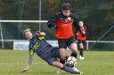 BATTLE: Action from East Christchurch SSC's FA Sunday Cup win over Navy Inn (Picture: BHFL)