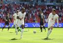 England's Raheem Sterling, left, celebrates after scoring his side's opening goal during the Euro 2020 soccer championship group D match between England and Croatia at Wembley stadium in London, Sunday, June 13, 2021. (Glyn Kirk/Pool Photo via