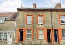 A mid-terraced property in North Allington, Bridport, will go under the hammer in July. Picture: Savills