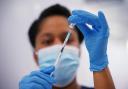 A medical professional preparing a vaccine. Credit: PA