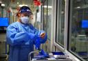 A nurse puts on PPE in a ward for Covid patients at King's College Hospital, in south east London.  Picture: PA