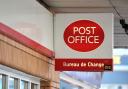 A sign for a post office