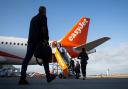 People boarding an easyjet flight. Credit: PA