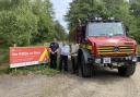 The new signs telling people that BBQS and fires are banned. Mike Radice - recreation ranger Forestry England, John Newcombe community safety Dorset Council, and Stephen Nicol DWFRS Picture: Dorset Council