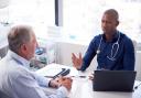 A doctor speaking with a patient. Credit: Canva