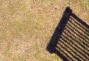 A Generic Photo of parched lawn with shadow of wooden deckchair. See PA Feature GARDENING Lawn. Picture credit should read: Alamy/PA. WARNING: This picture must only be used to accompany PA Feature GARDENING Lawn...