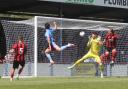 Tom Bearwish, centre left, nods home Weymouth's second goal