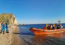 The lifeboat team arriving at St Oswalds beach