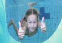 A child enjoying a swim