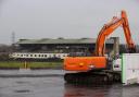 Contractors with excavators have begun clearing the concrete seating terraces at GAA stadium in Belfast, Northern Ireland, ahead of the long-delayed redevelopment of the stadium (PA)