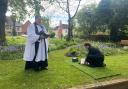 Robert Forbes's ashes being put in the garden