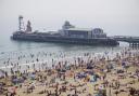 Thousands flock to soak up sun on sand in first warm weekend of the year