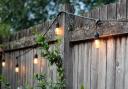 Check to see if you can hang or attach items to a neighbour's fence.