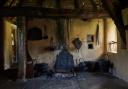 Witch post and fire place, in 'Stang End' longhouse, Ryedale-Folk-Museum