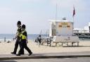 File image of police officers walking along a stretch of Bournemouth sea front