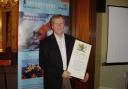 Dave Corben receiving his record of service certificate in 2020.