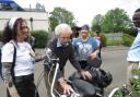 Fernhill resident Nigel Gullis has a hands-on look at a bike with, from left: Companionship Team Leader Cara Duroe, Nurse Agi Ciok and Home Manager Francis Bosompim.