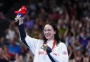 Great Britain's Alice Tai on the podium with the gold medal after winning the Women's 100m Backstroke - S8 Final at the Paris La Defense Arena on day three of the Paris 2024 Summer Paralympic Games. Picture date: Saturday August 31, 2024.