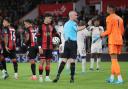 AFC Bournemouth v Chelsea  at Vitality Stadium.. Referee Anthony Taylor talks tocheklsea goalie Robert Sanchez while Evanilson waits to take the penalty.