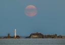 The harvest supermoon over Portland Breakwater