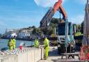 The team from the Environment Agency installing the wave barriers on Lower High Street 17 September