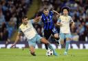 Manchester City’s Rodri and Inter Milan’s Henrikh Mkhitaryan (right) battle for the ball (Nick Potts/PA)