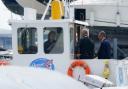 A group of people inspecting the cabin of the Dorset Belle cruise boat which was impounded at Cobb's Quay Marine in Poole (Andrew Matthews/PA Wire)