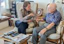 Vikki Slade speaking to a pensioner