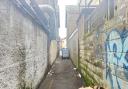 An alleyway was also cordoned off as a result of the investigation.