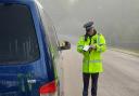 Police officers stop cars speeding in the New Forest