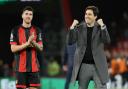 Andoni Iraola and Marcos Senesi celebrate after beating Arsenal