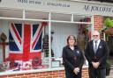 Debbie Brown and Adrian Read from Jolliffe & Son in Ferndown in front of the window