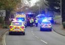 Road closed after car flips on its roof