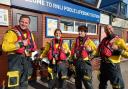 Poole RNLI volunteers with their Blue Peter badges and Joel