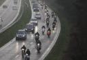 The convoy of scooters and motorcycles heads up the A338 spur road