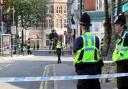 Police stood at the cordon following the shooting at Roumelia Lane last July