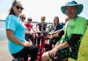 Mickey Storey, right, takes Poole Park visitors for a ride on a seven-seater Conference bike for Borough of Poole's Bike Day, publicising the Momentum Cycle Challenge