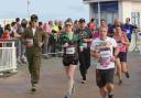 44-year-old Nick Hitchings - far left - ran the 5k, 10k, half marathon and full marathon