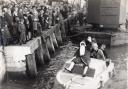 William Meads (in the while bottle hat on the boat) during a visit from Santa at Poole Quay