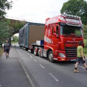 A second tractor was forced to make the tight squeeze under the bridge