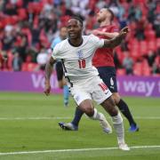 England's Raheem Sterling celebrates after scoring his side's opening goal during the Euro 2020 soccer championship group D match between Czech Republic and England, at Wembley stadium in London, Tuesday, June 22, 2021. (AP Photo/Laurence